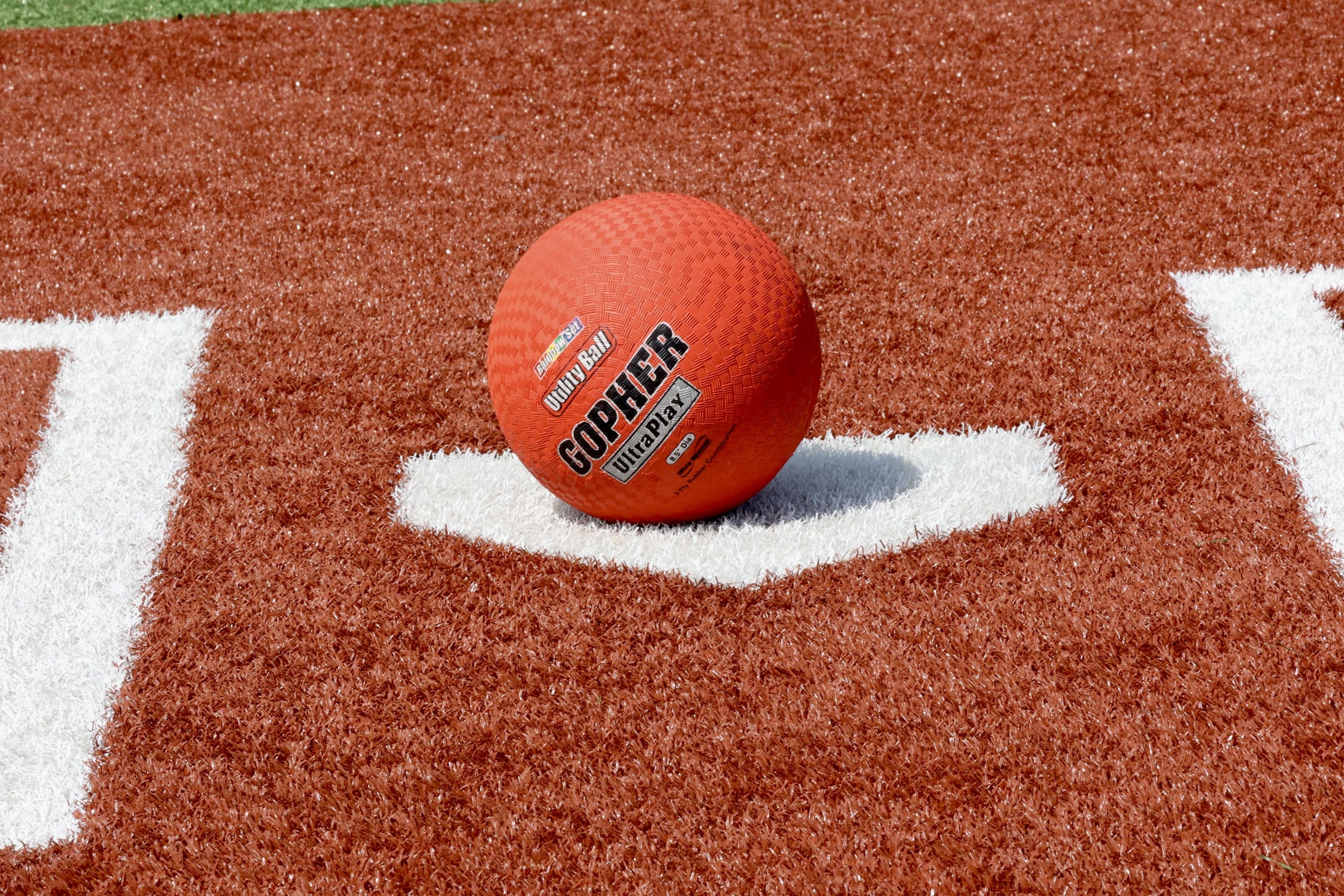298A6891-scaled Photo of a kickball sitting on home plate, ready for the game.