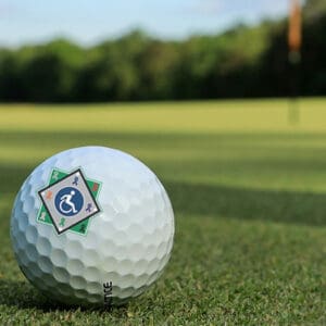 photo of a golf ball with the RWJBH Field of Dreams logo on it