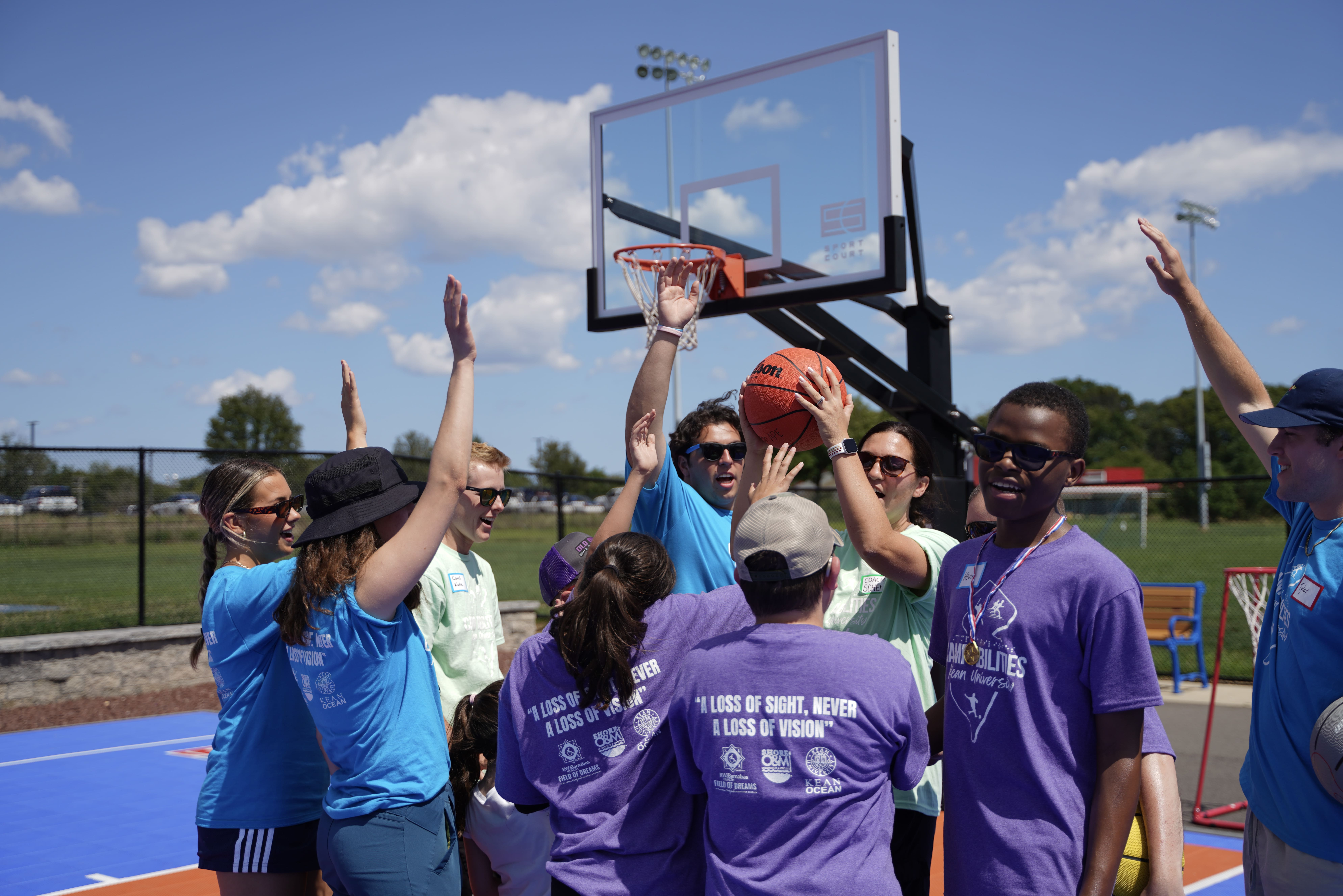 DSC05814 Photo of a group of children holding a blind football